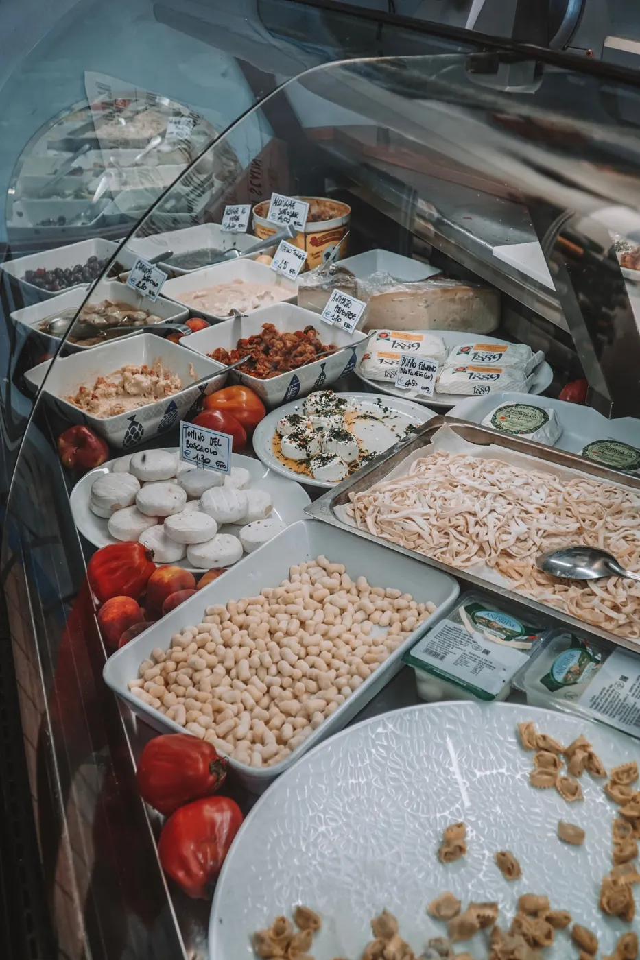 Deli counter with cheese, fresh pasta and antipasti