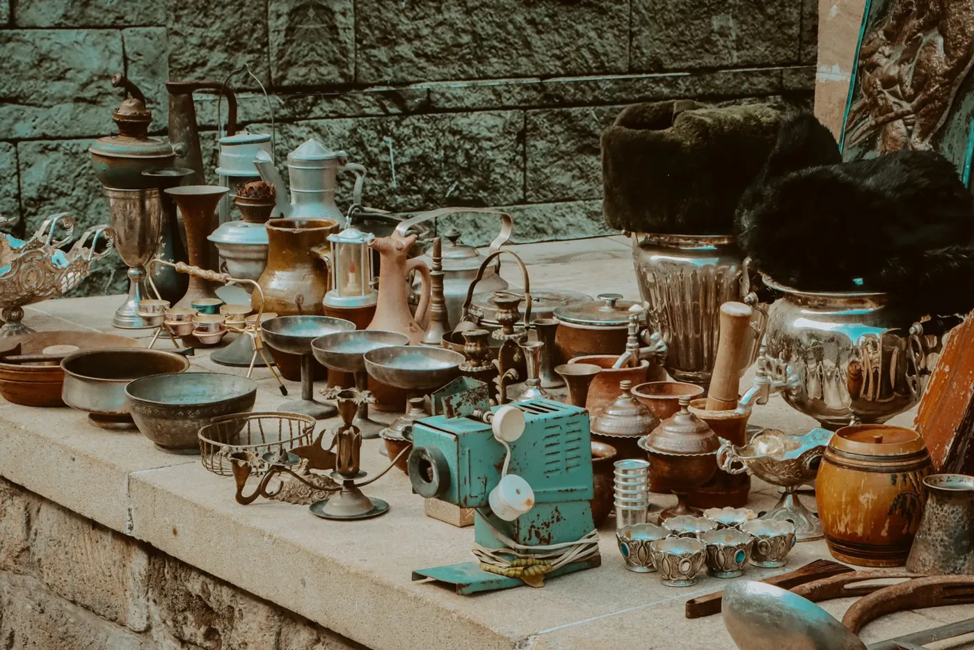 Bric-a-brac and antiques on a flea market stall