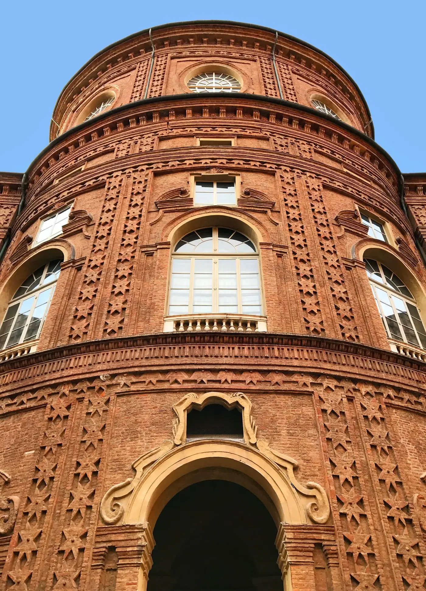 Brick façade of Palazzo Carignano, seat of the first Italian parliament